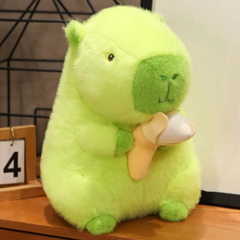 Green capybara plush with banana